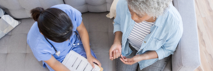 A doctor helping a patient complete a form